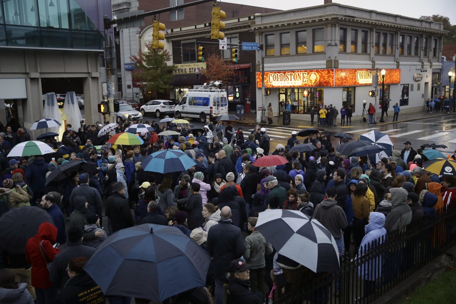 People gather for a vigil in the aftermath of a deadly shooting at the Tree of Life Synagogue, in the Squirrel Hill neighborhood of Pittsburgh, Saturday, Oct. 27, 2018.