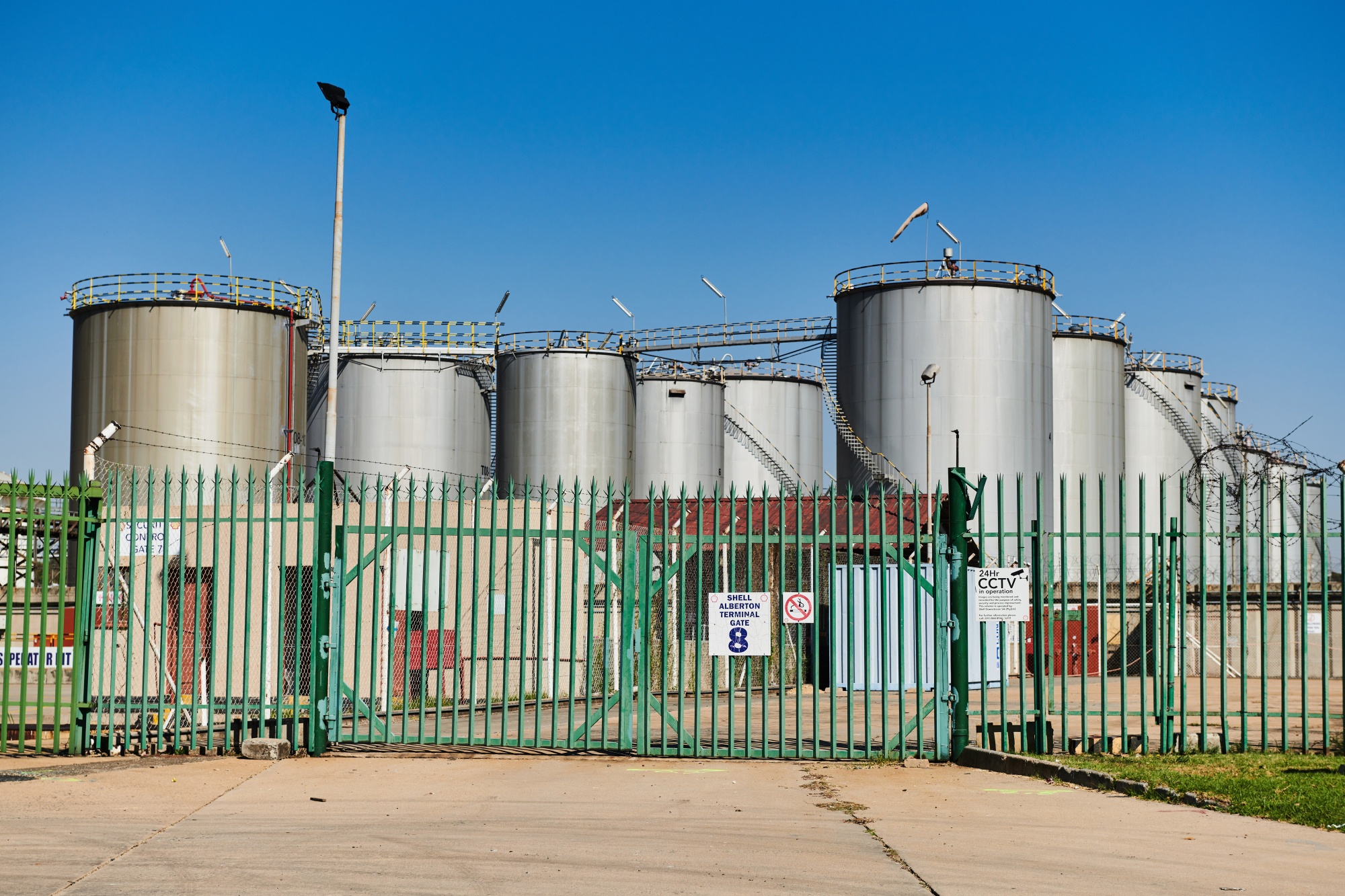 Storage tanks at a petroleum depot in Johannesburg. Photographer: Waldo Swiegers/Bloomberg
