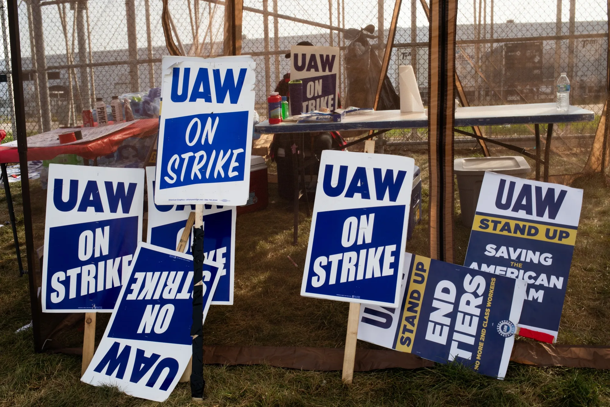 Signs as United Auto Workers (UAW) members picket outside the Stellantis NV Toledo Assembly Complex in Toldeo, Ohio, on Sept. 22.