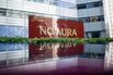 Nomura Holdings branding.