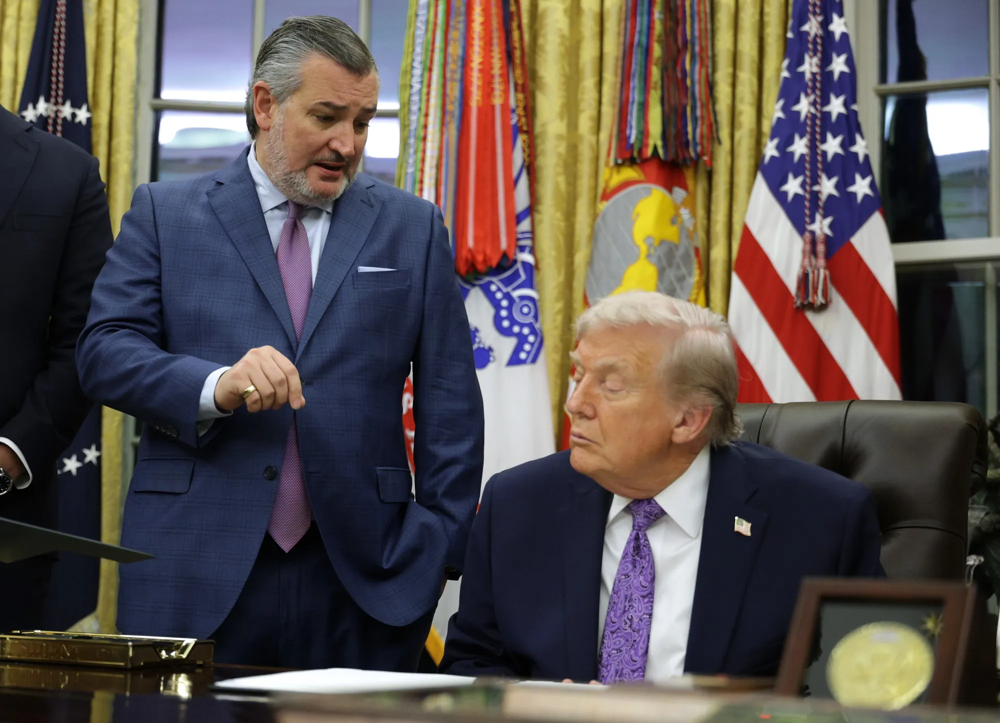 Senator Ted Cruz and President Donald Trump talk in the Oval Office on Dec. 11, 2025.