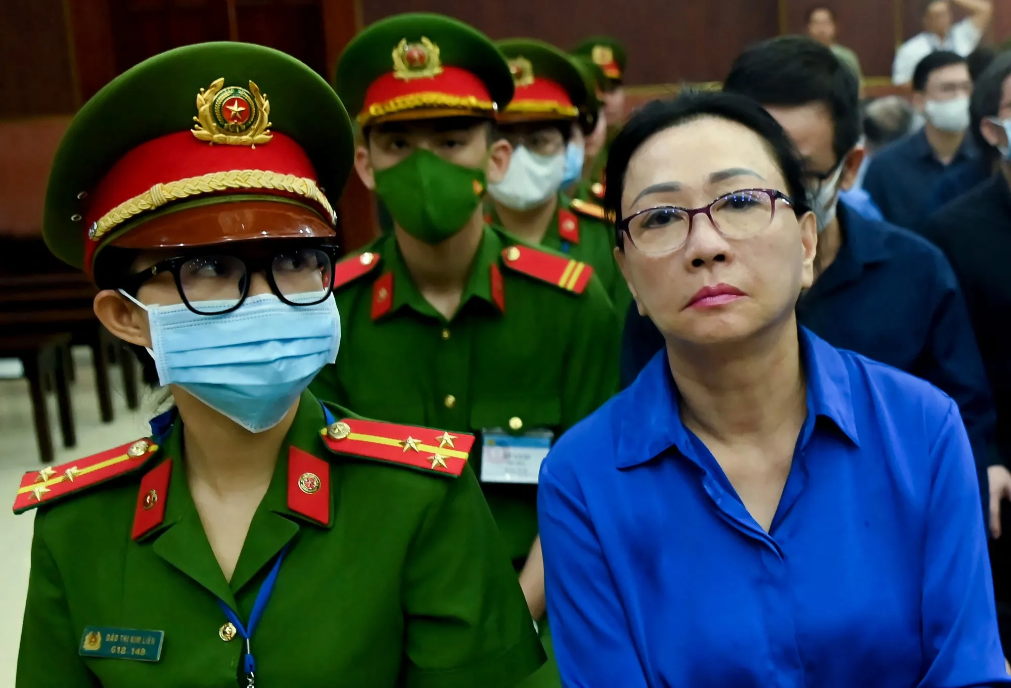 Truong My Lan, right, at a court in Ho Chi Minh City on Dec. 3.