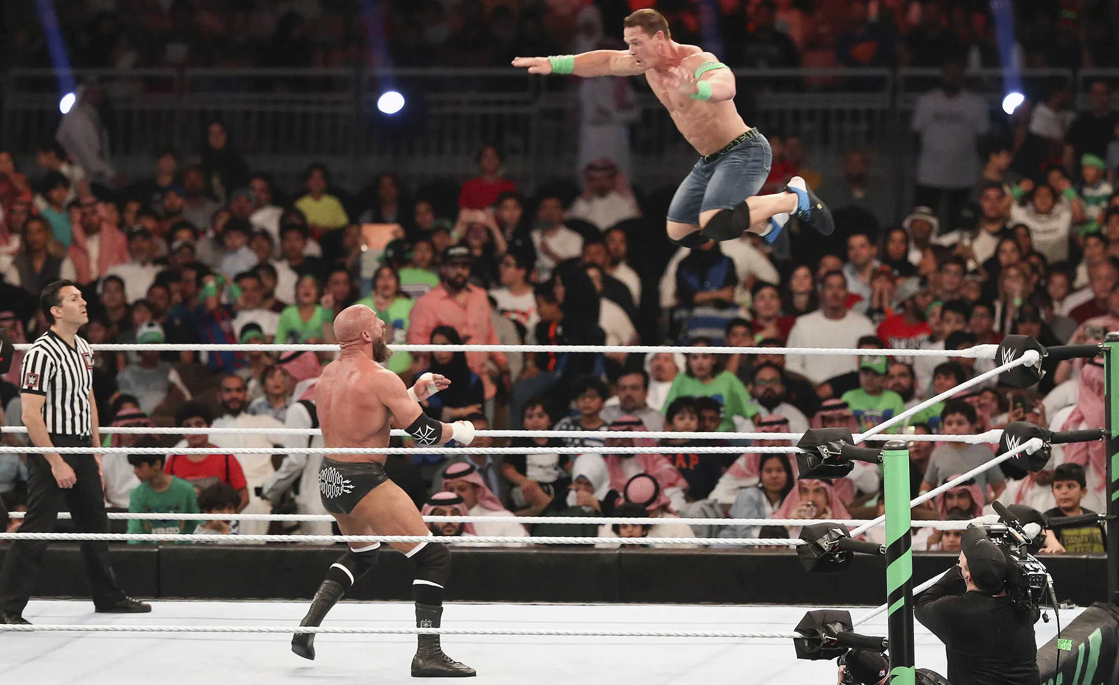 TOPSHOT - John Cena (R) competes with Triple H during the World Wrestling Entertainment (WWE) Greatest Royal Rumble event in the Saudi coastal city of Jeddah on April 27, 2018. (Photo by STRINGER / AFP) (Photo credit should read STRINGER/AFP via Getty Images)