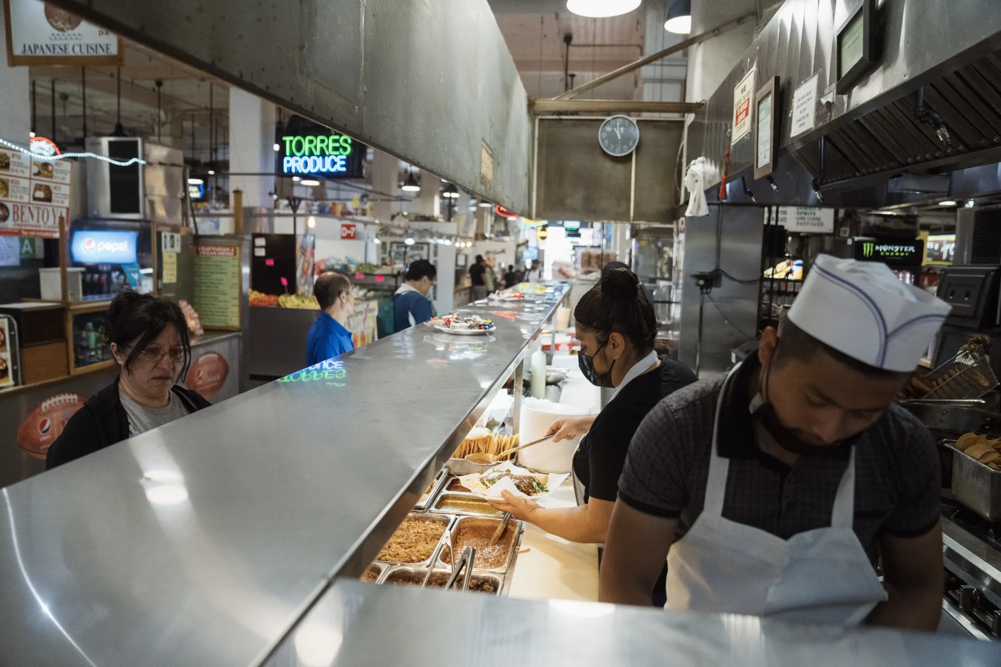 Wall Street is intensely tracking the strength of nonfarm payrolls —&nbsp;a category&nbsp;that includes workers such as these at a Los Angeles restaurant —&nbsp;for clues to&nbsp;what the Federal Reserve will do next.