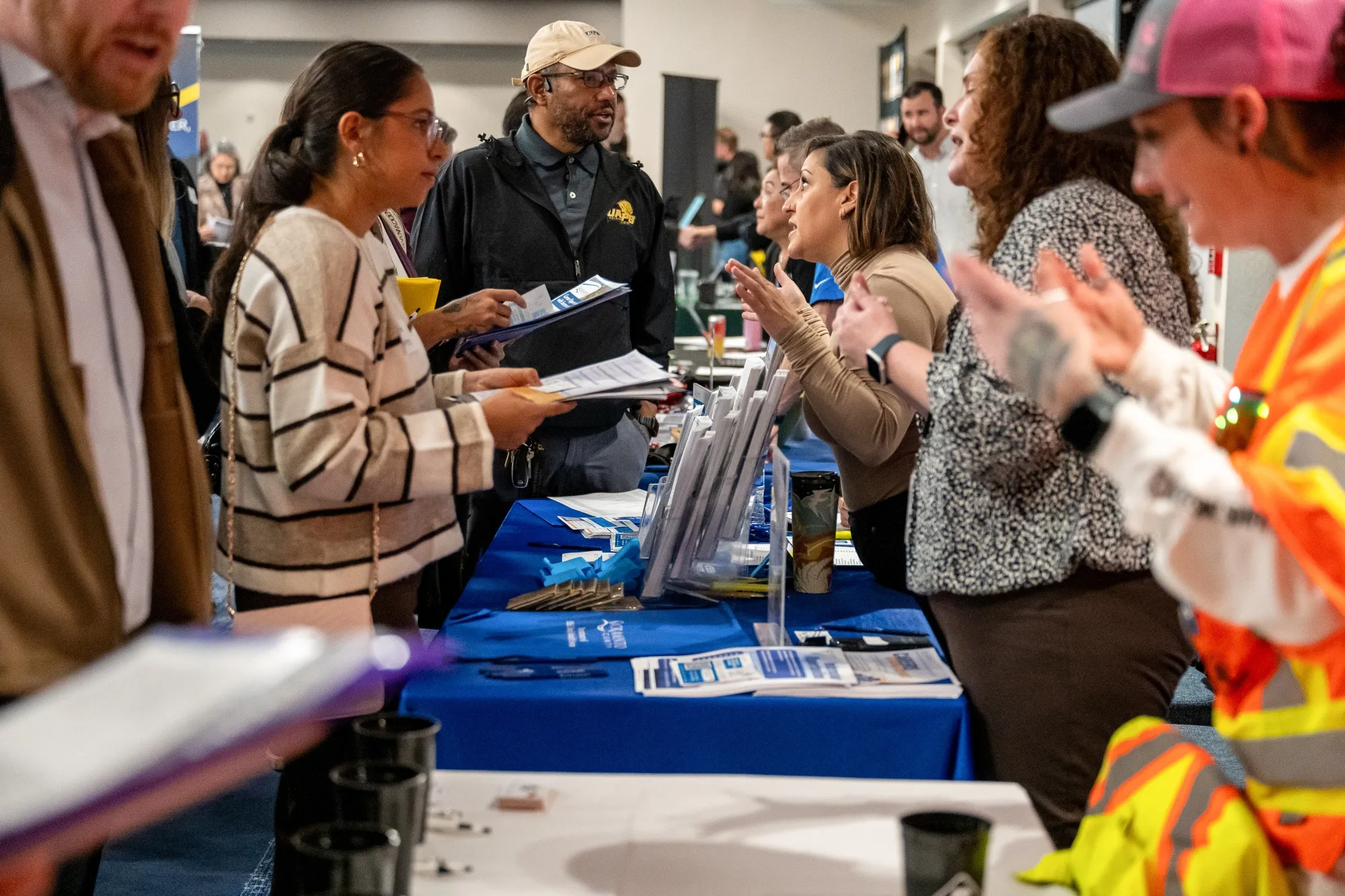 Job seekers speak with recruiters during a job fair in Sacramento, California.