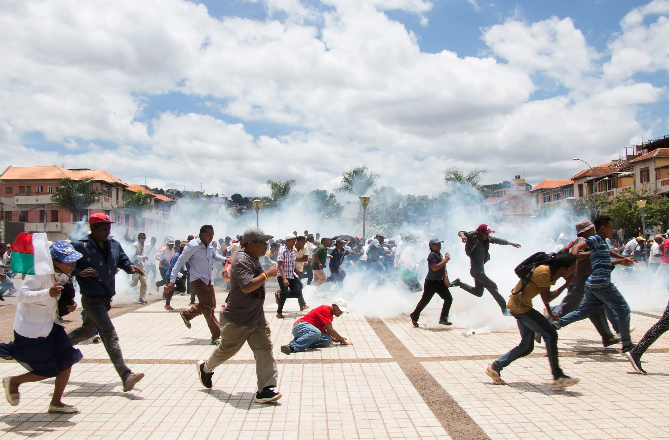 Supporters of Marc Ravalomanana scramble as security forces fire tear gas on Jan 2.&nbsp;