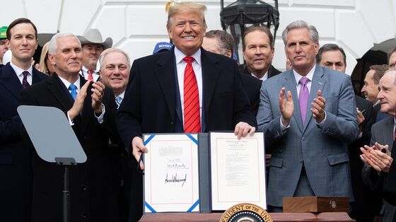 Trump Signs USMCA, Sealing Political Win With Bipartisan Deal