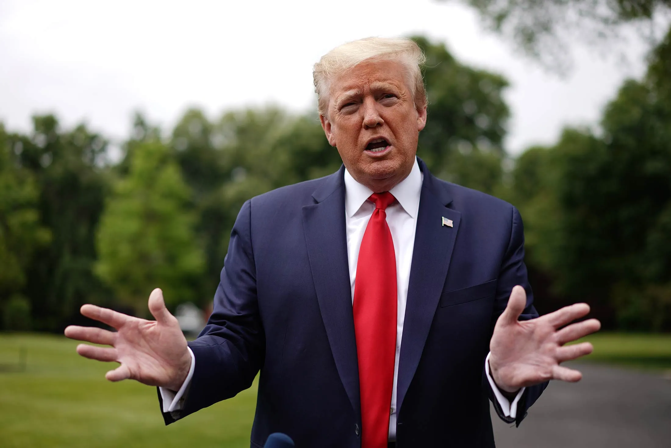 Donald Trump speaks to members of the media&nbsp;as he departs the White House in Washington&nbsp;on May 21.&nbsp;