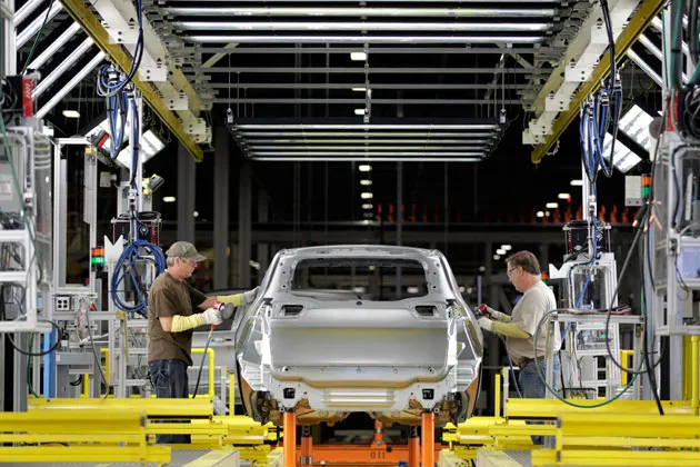 Autoworkers build a Jeep Cherokee at the Chrysler Group Toledo Assembly Complex in Ohio