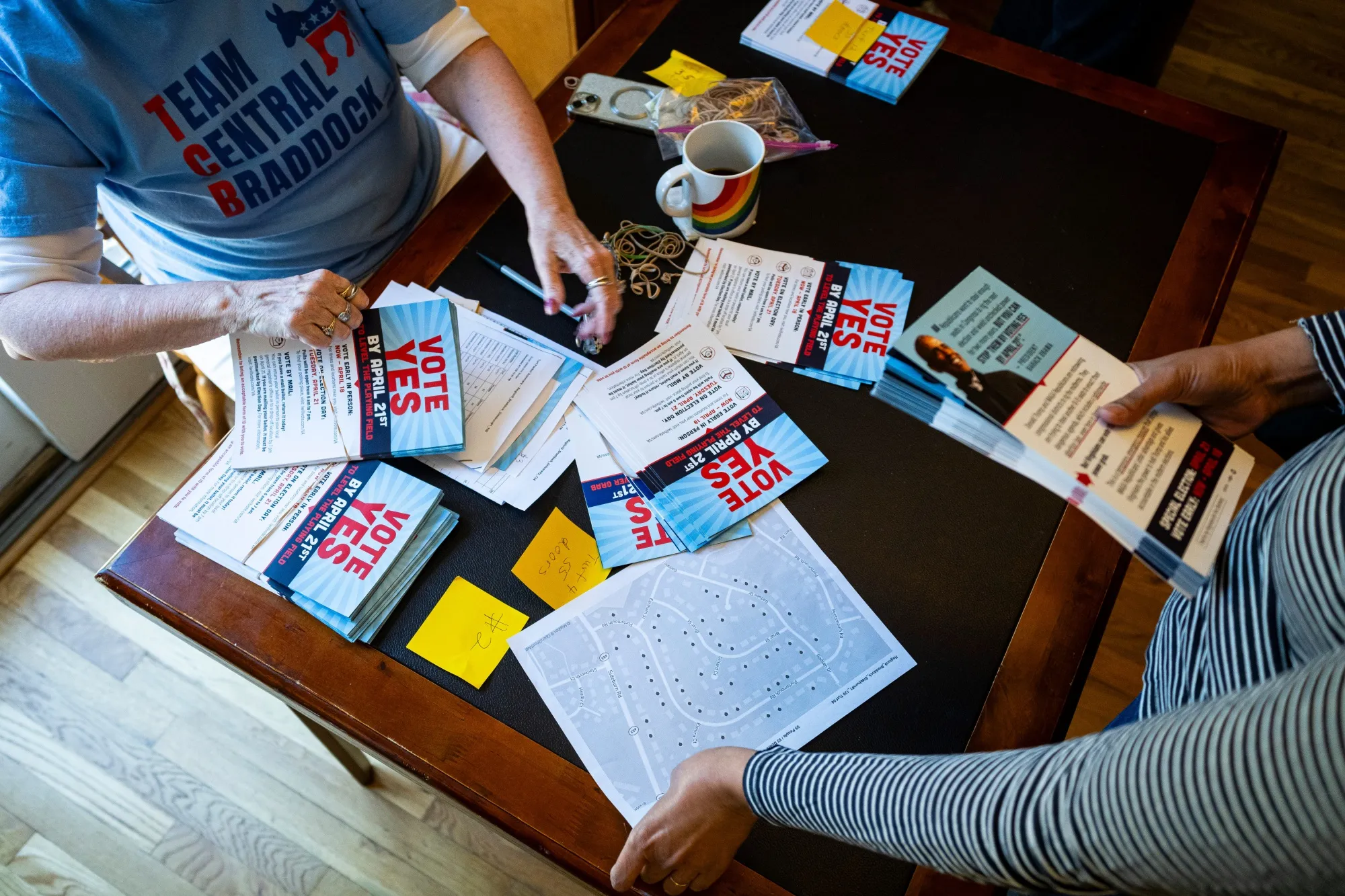 Volunteers pass out campaign materials during a canvassing event in Braddock, Virginia.