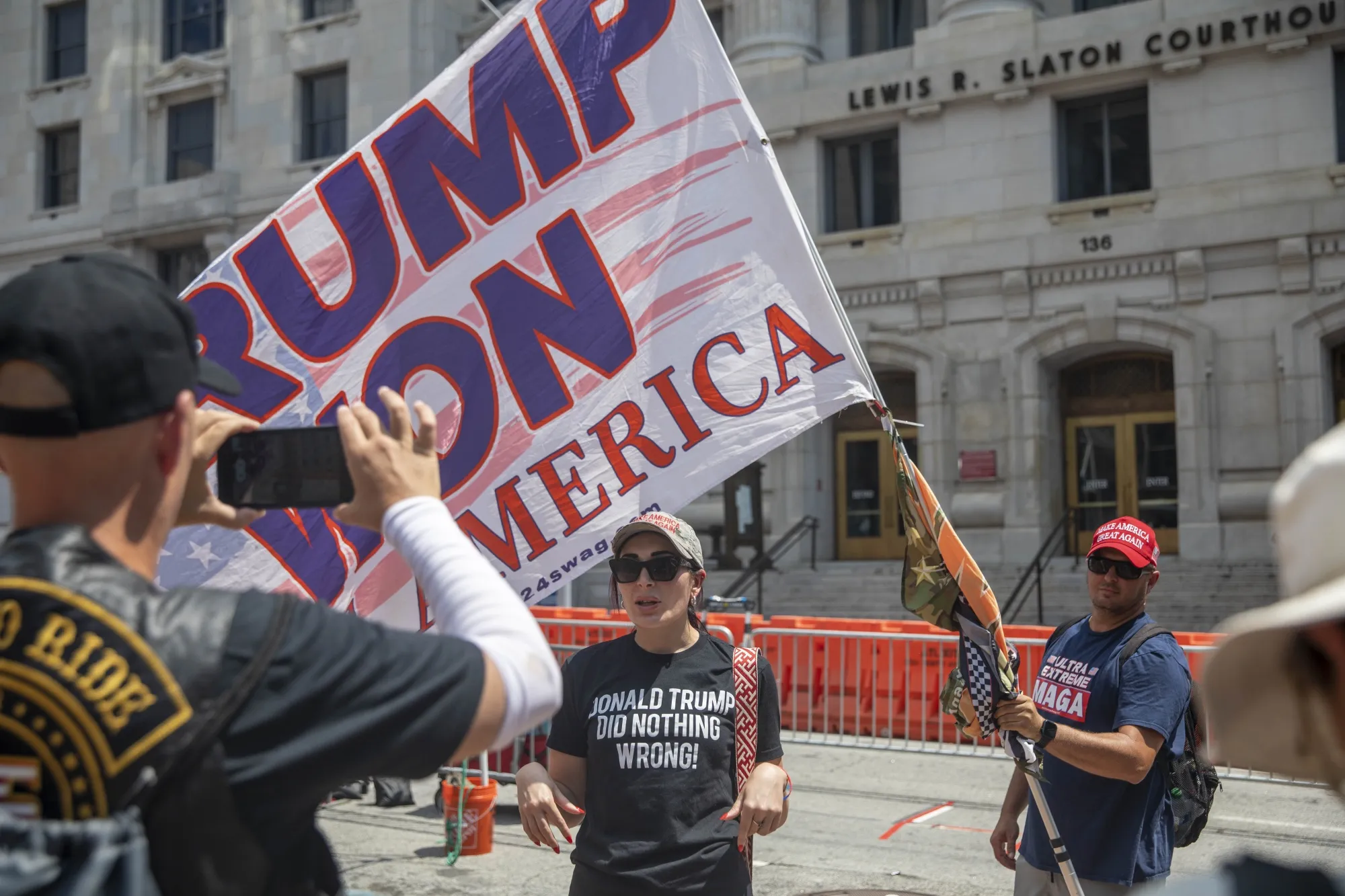 Supporters of former President Donald Trump rally outside of the Fulton County Courthouse in Atlanta on Aug. 25.