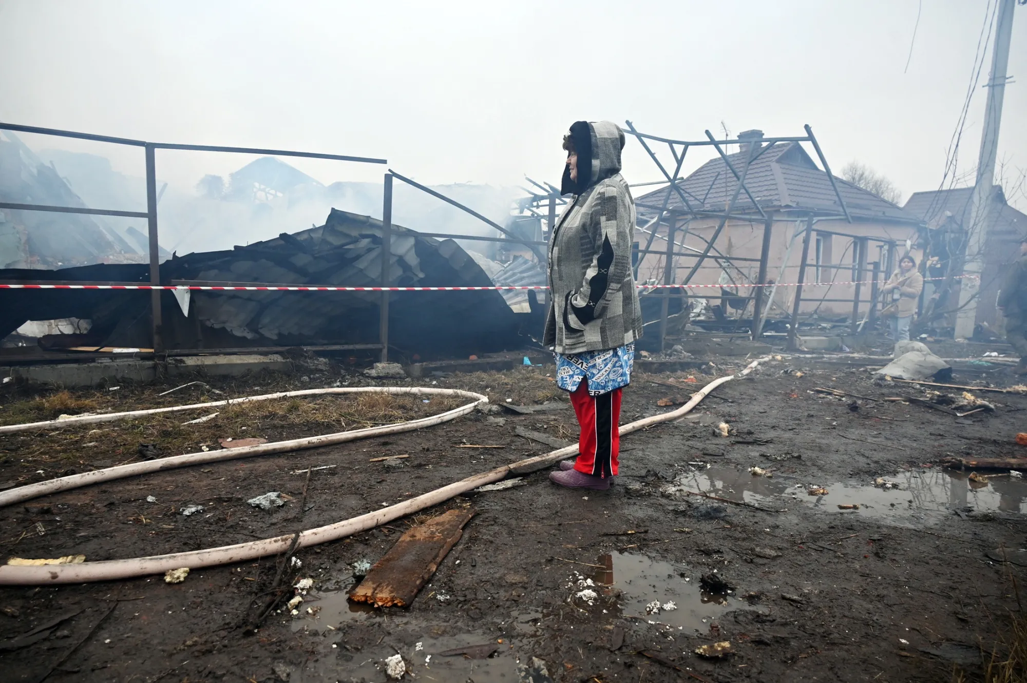 A resident looks over damage following a Russian attack, in Kharkiv, Ukraine, on Dec. 25.
