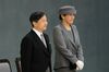 Japan's Emperor Naruhito, left, and Empress Masako stand during a memorial service marking the 74th anniversary of the end of World War II at Nippon Budokan in Tokyo, Japan.
