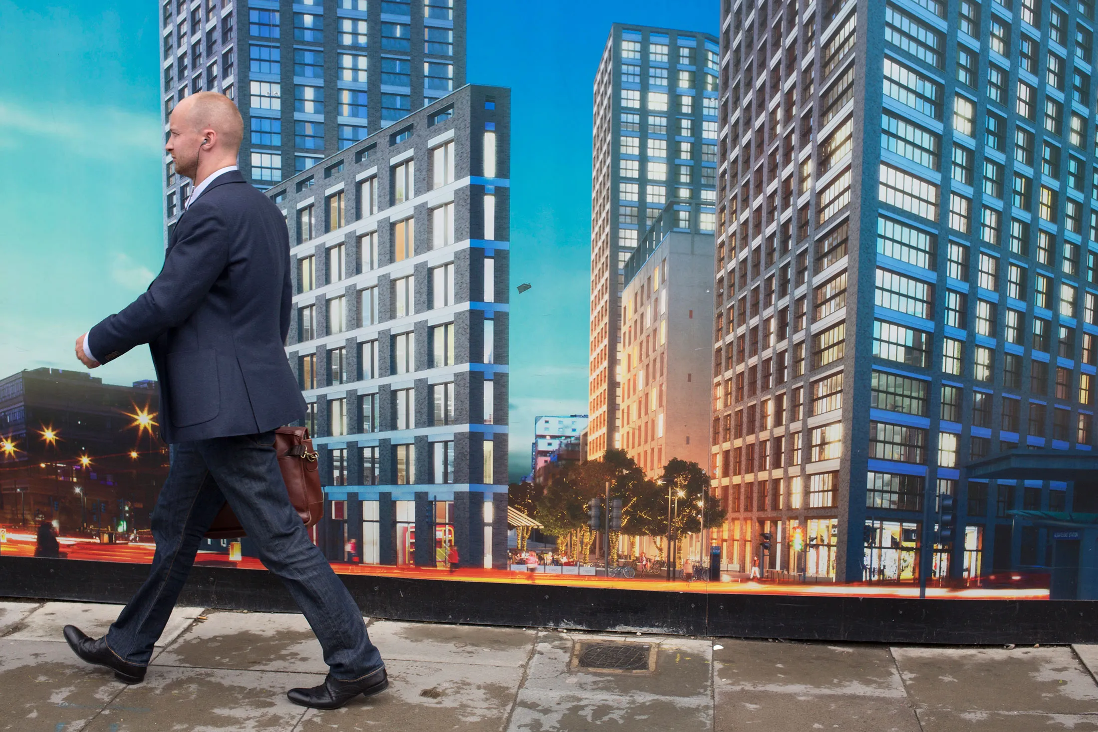 Architectural hoarding outside the construction site for a new block of apartments in Aldgate.
