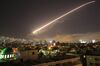 The Damascus sky lights up missile fire as the U.S. launches an attack on Syria targeting different parts of the capital early Saturday, April 14, 2018.