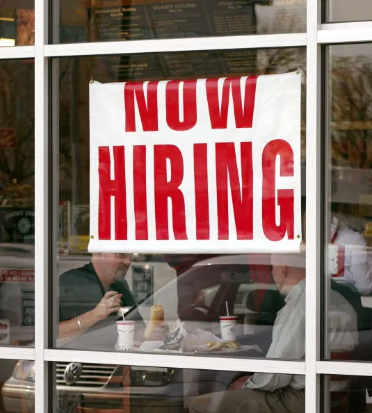 The economy unexpectedly added jobs in May.
