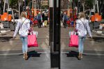 A pedestrian carries shopping bags in San Francisco, California.