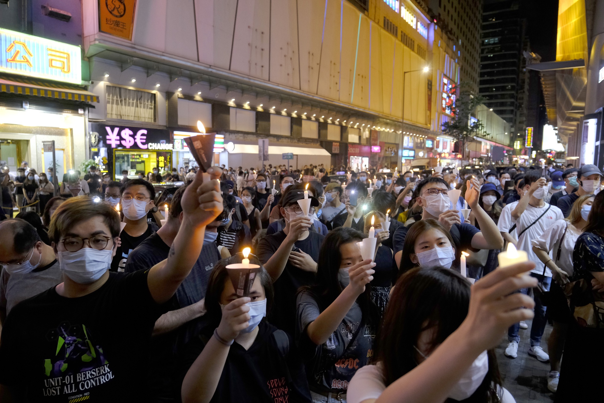 People hold candles as they gather to commemorate the 31st anniversary of the Tiananmen Square crackdown, in Hong Kong on June 4.