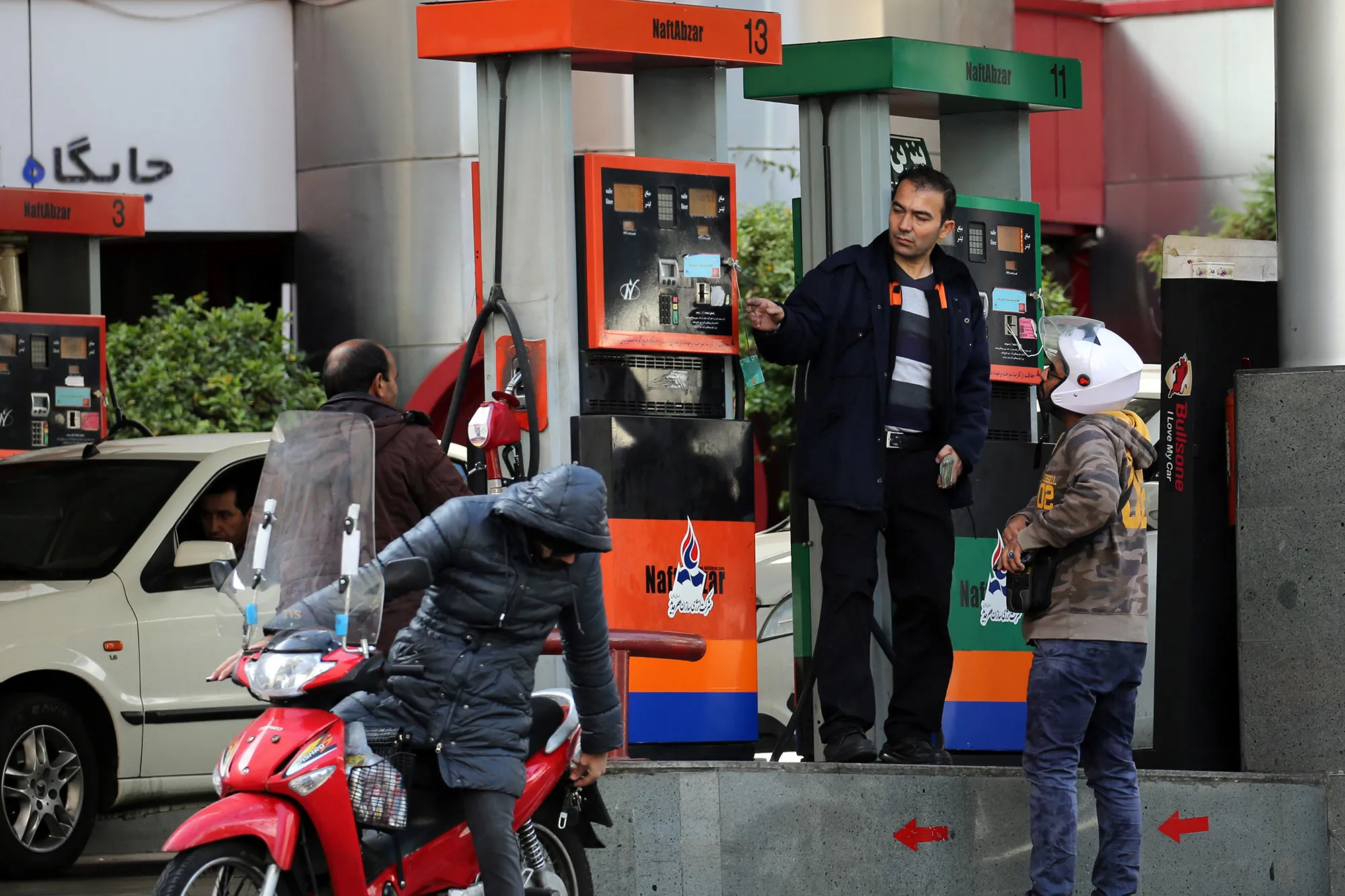Iranians fill their vehicles at a petrol station in Tehran, on November 15, 2019.