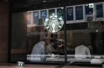 Customers inside a Starbucks Corp. coffee shop in the Shinjuku district of Tokyo, Japan, on Friday, May 28, 2021. 