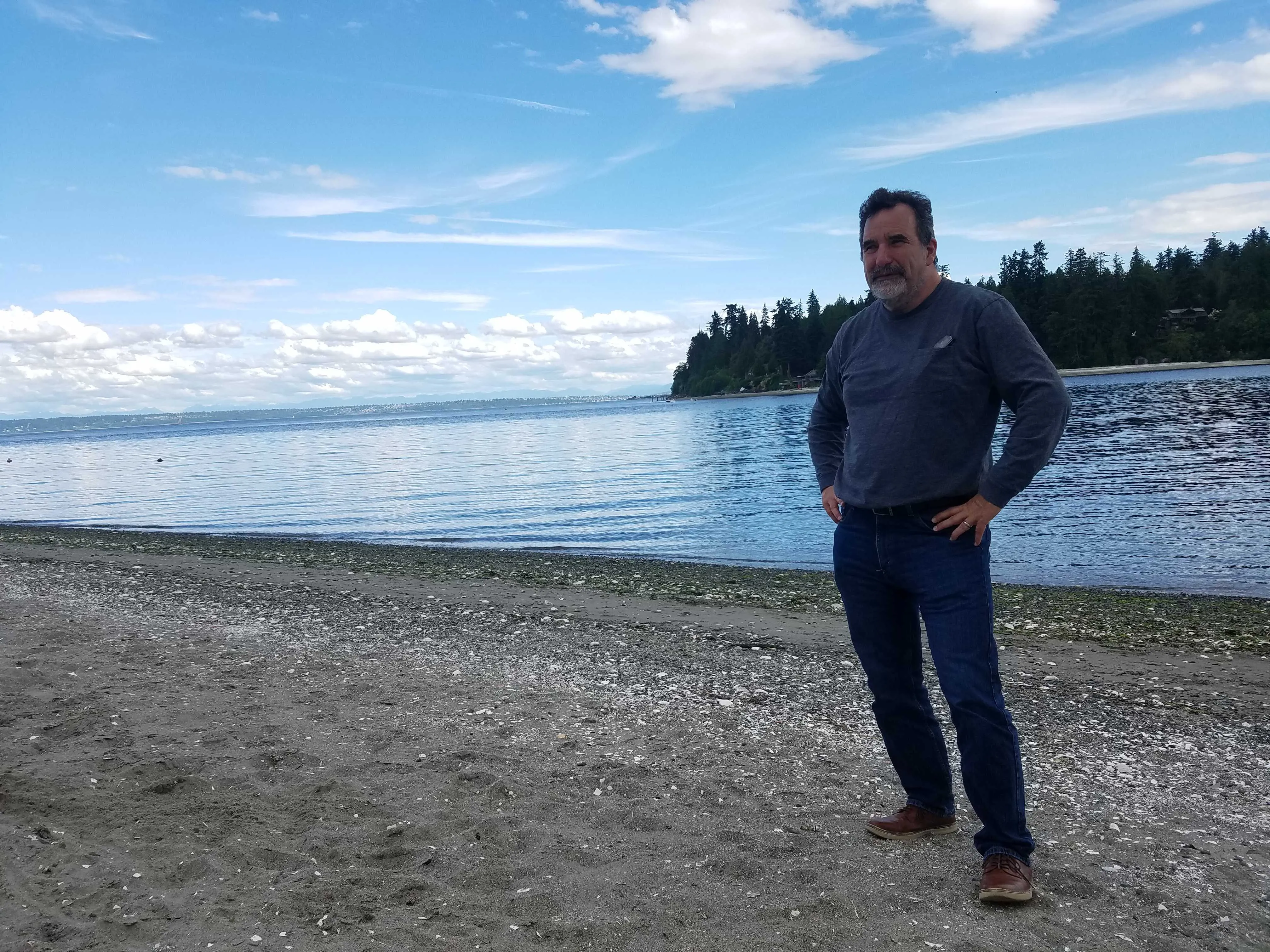 Leonard Forsman, chairman of the Suquamish Tribal Council, stands on sacred land reclaimed by the tribe near where Chief Seattle’s long house was burned down by the US government. The city of&nbsp;Seattle is visible across&nbsp;Puget Sound from this Native American reservation.&nbsp;