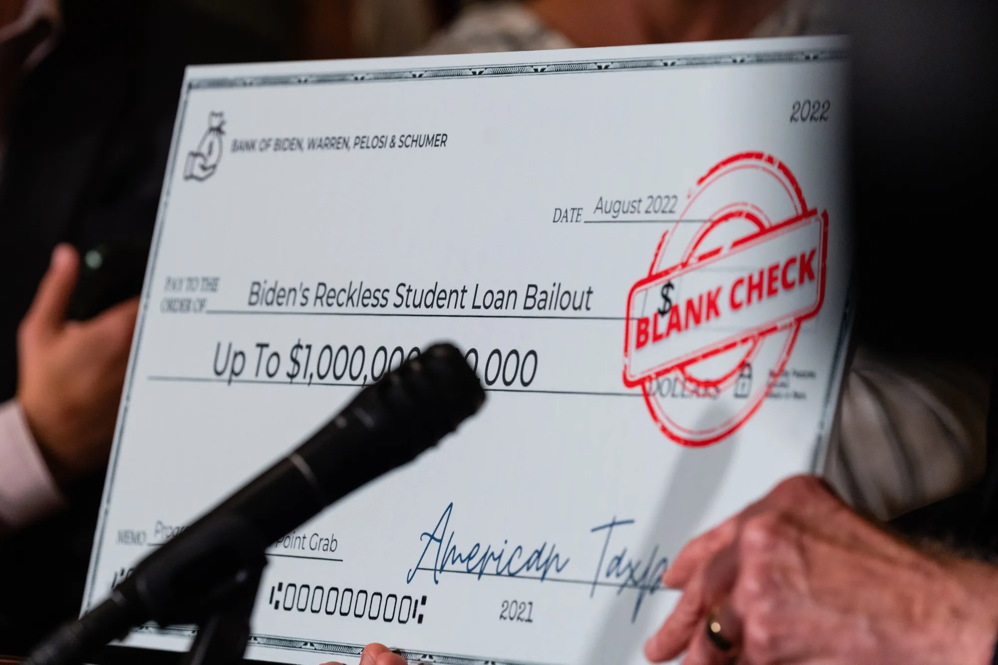 A mock check during a news conference following the weekly Republican caucus luncheon in DC.
