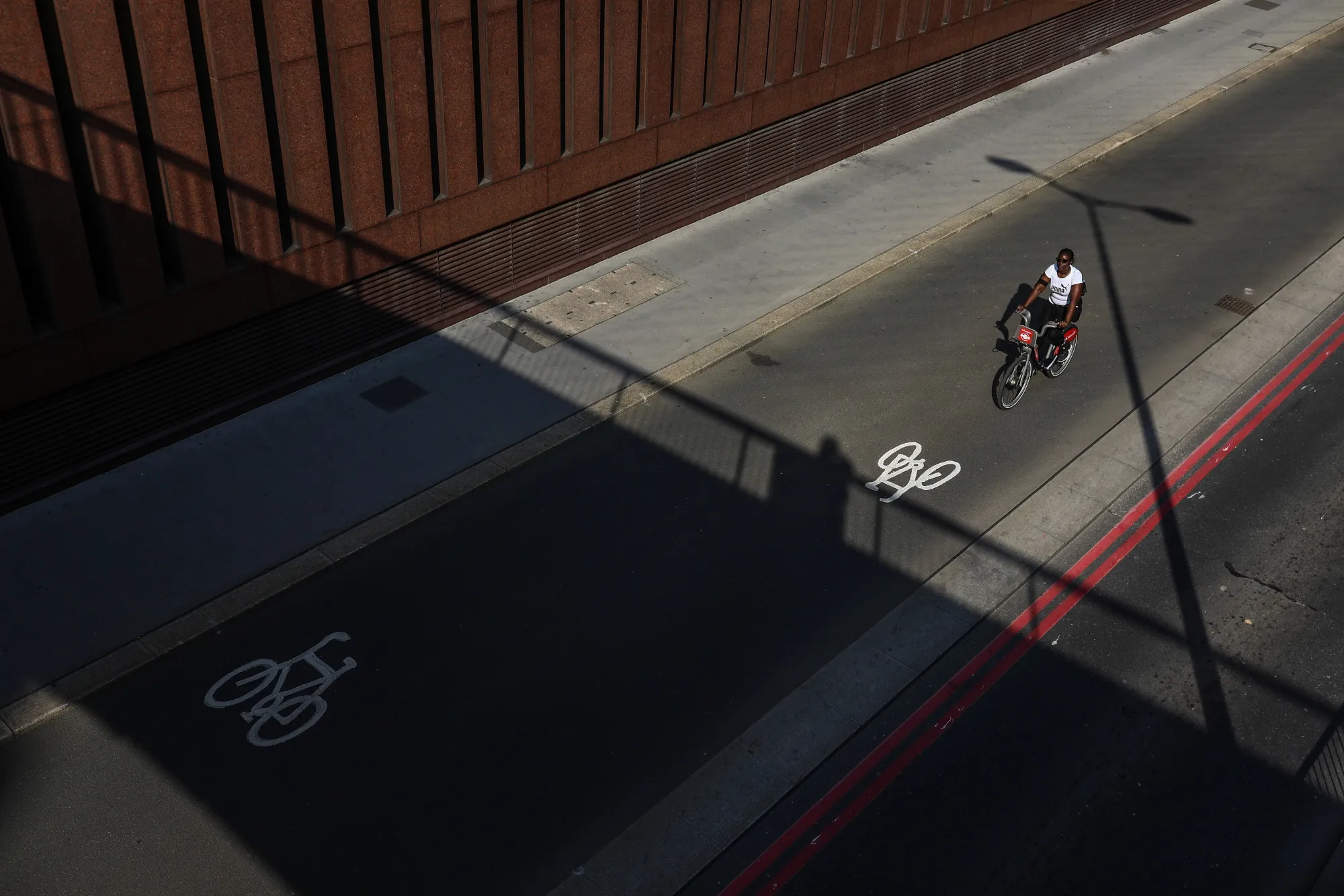 A cyclist travels in a cycle lane in London, on April 24.