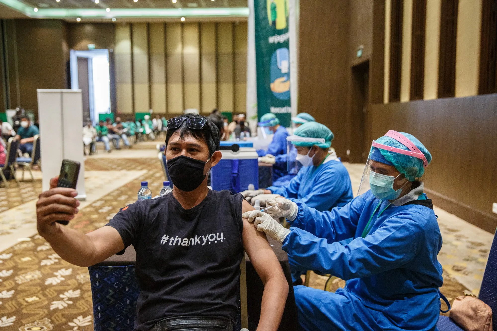 A healthcare worker administers a dose of the Sinovac vaccine in Bali, Indonesia, on Feb. 28.