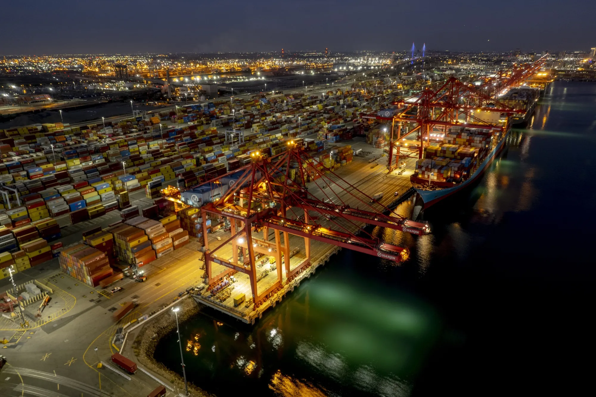 Cargo ships are unloaded at the Port of Long Beach in Long Beach, California.