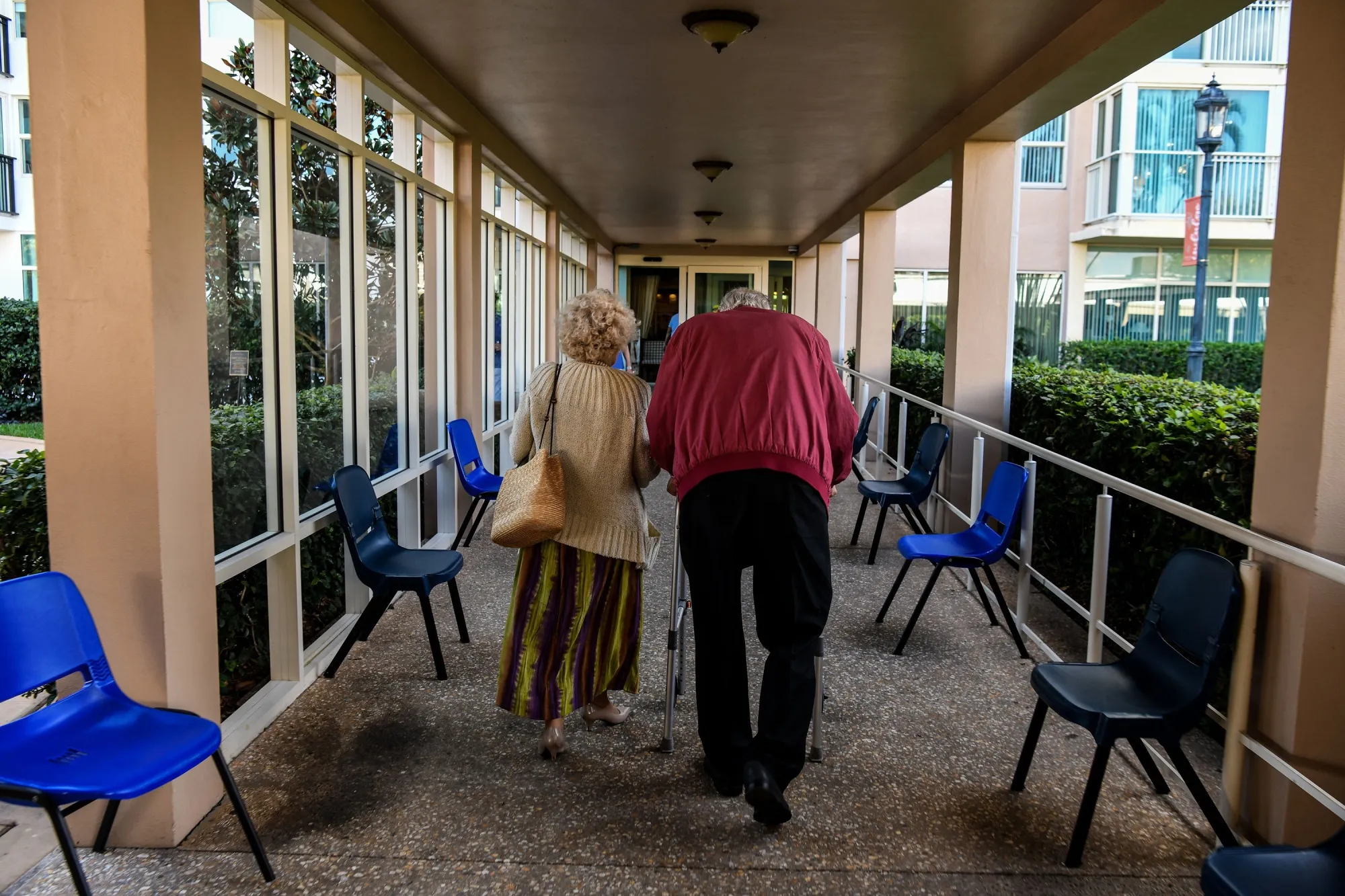 Elderly residents walks inside&nbsp;a retirement community in Pompano Beach, Florida.