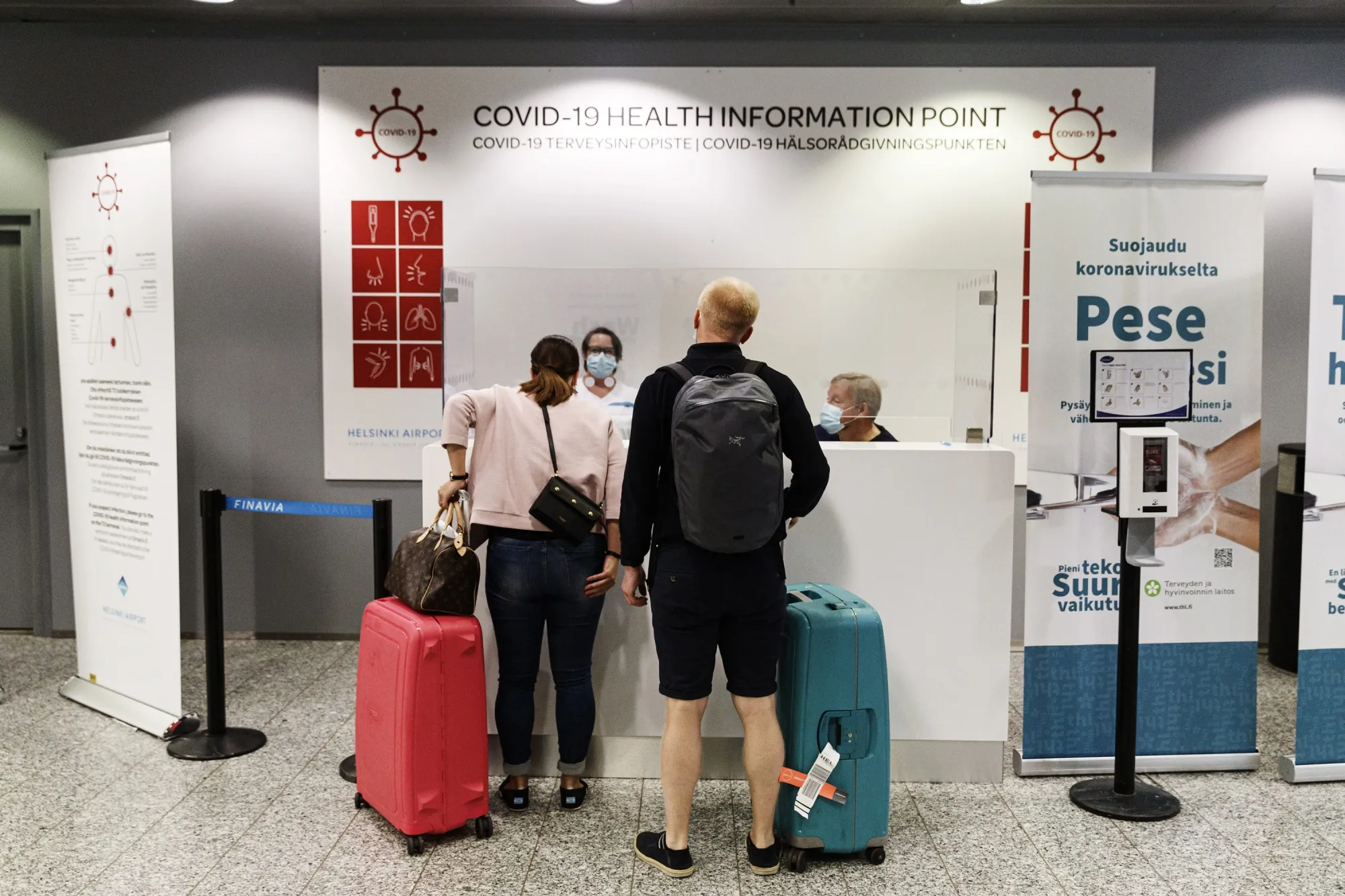 Travelers ask for instructions at&nbsp;Helsinki-Vantaa airport in Vantaa, Finland on Aug. 3.