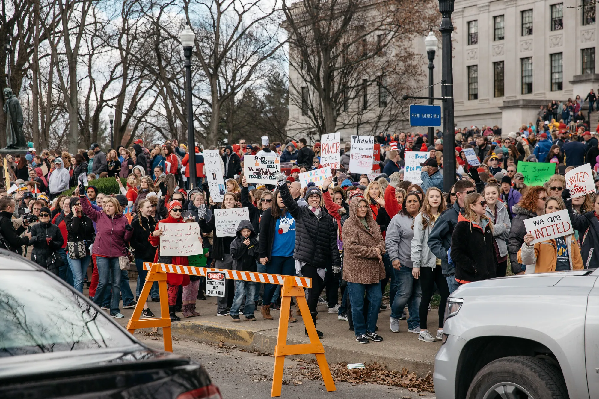 Teachers and demonstrators hold signs during a rally outside the West Virginia Capitol in Charleston, West Virginia, on March 2, 2018.&nbsp;