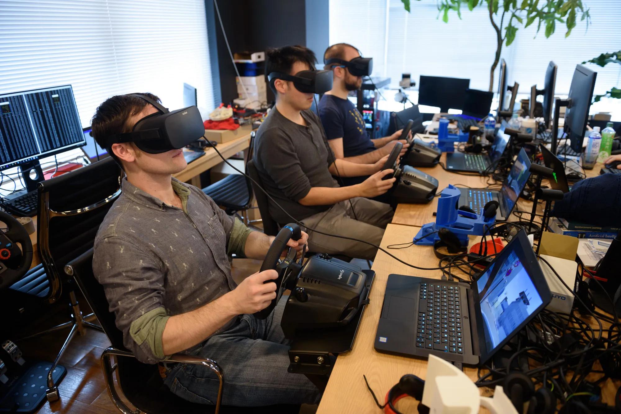 Employees perform maneuvers on the Ascent Atlas software.