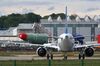 An Airbus A321 NEO passenger aircraft, operated by China Southern Airlines Co., taxis near a fuselage section outside the Airbus SE factory in Hamburg, Germany, on Wednesday, May 13, 2020. Airbus secured just nine net orders in April and delivered 14 jetliners after airlines desperate for cash put off accepting new planes and clamped down on spending to deal with a crisis that could last several years.