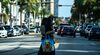 A woman wears a mask as she walks in Miami Beach, Florida on July 2, 2020.