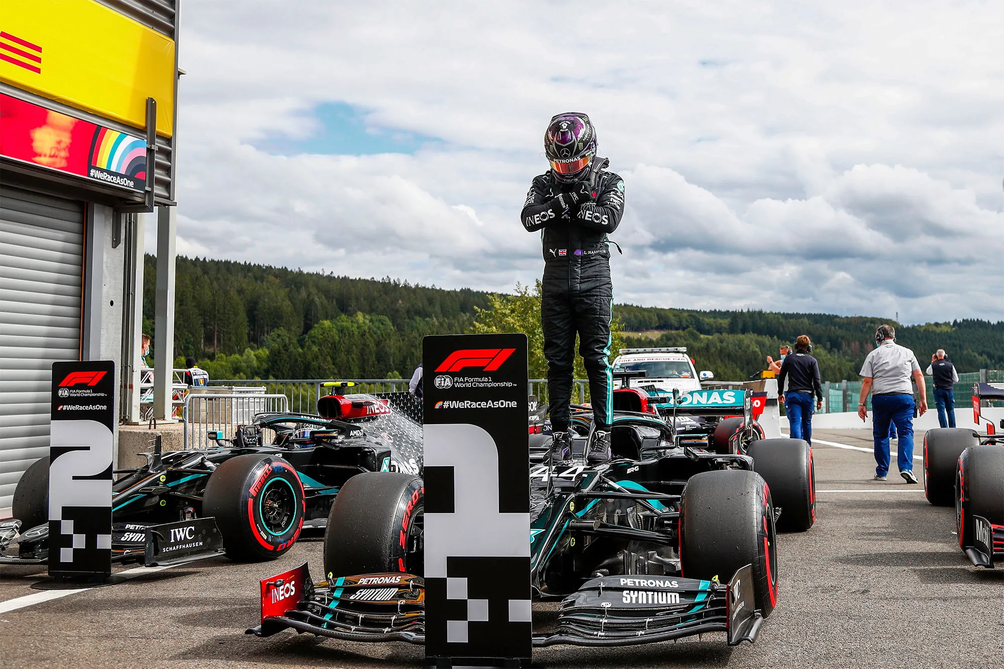 Lewis Hamilton gestures as he poses after securing his 93rd pole position.