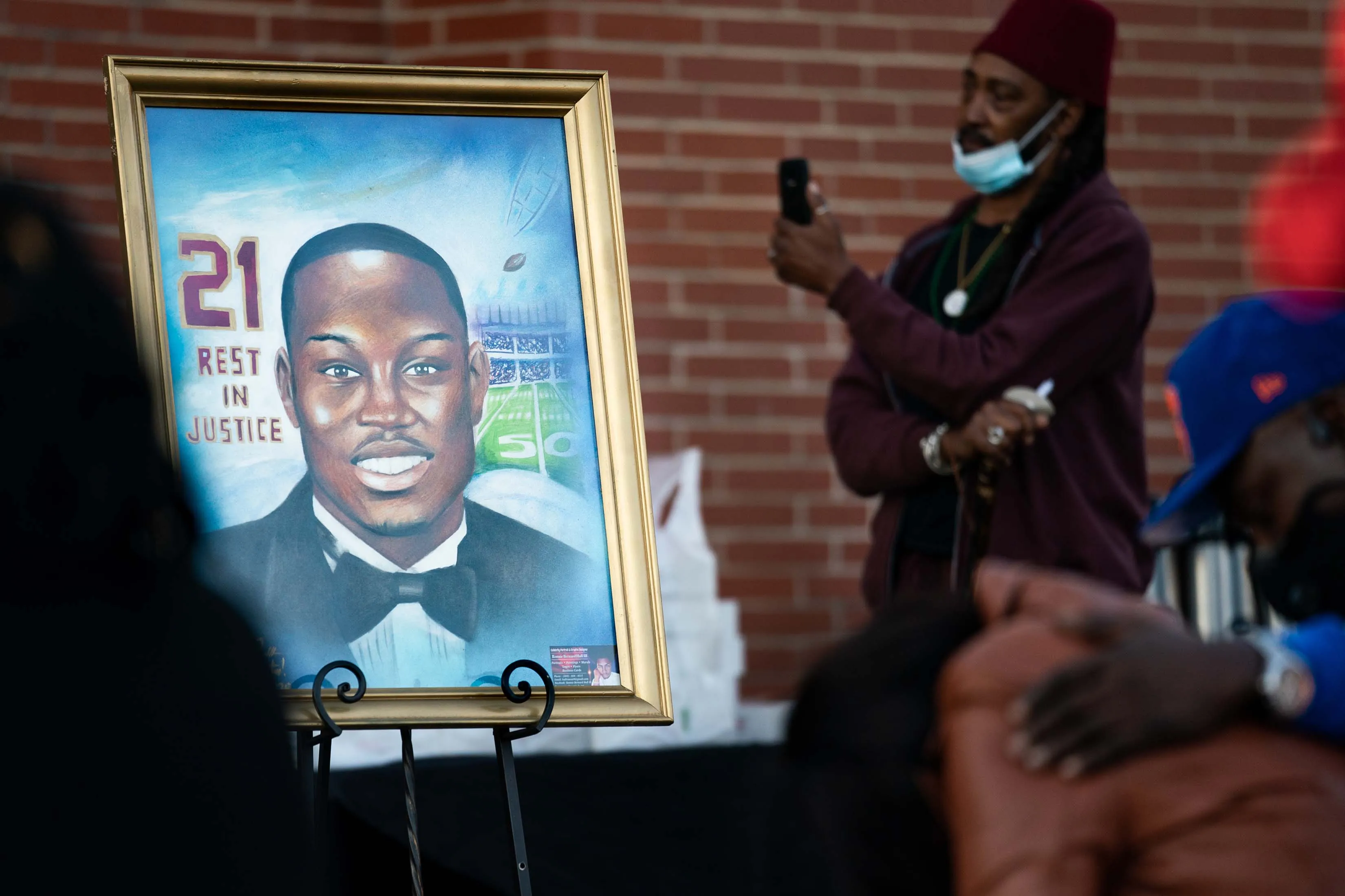 A painting of Ahmaud Arbery during a vigil in Georgia.
