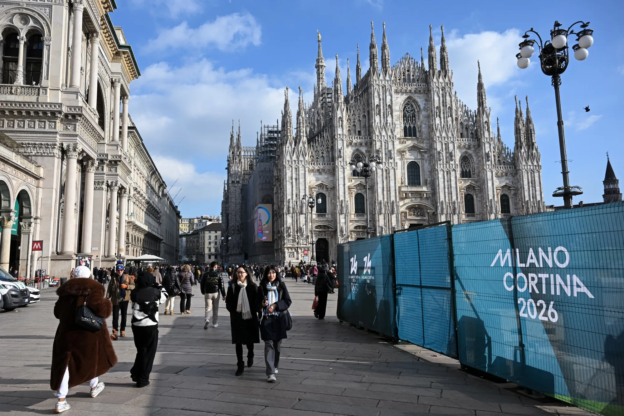 People walk past Milano Cortina 2026 Olympic Games fences at Piazza Duomo ahead of the&nbsp;Olympic Games in Milan on Jan. 26.&nbsp;