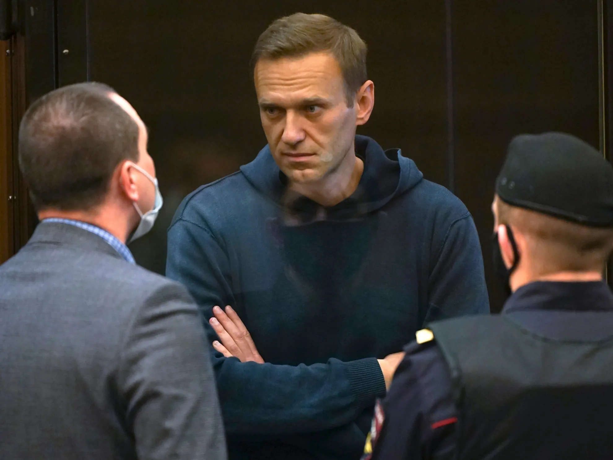 Navalny talks to one of his lawyers during the Feb. 2 Moscow court hearing.