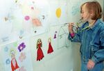 A child draws as part of a therapy program designed to help kids deal with trauma. 