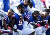 Buffalo Bills players kneel during the American National anthem before an NFL game against the Denver Broncos on September 24, 2017 at New Era Field in Orchard Park, New York.