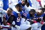 Buffalo Bills players kneel during the American National anthem before an NFL game against the Denver Broncos on September 24, 2017 at New Era Field in Orchard Park, New York.
