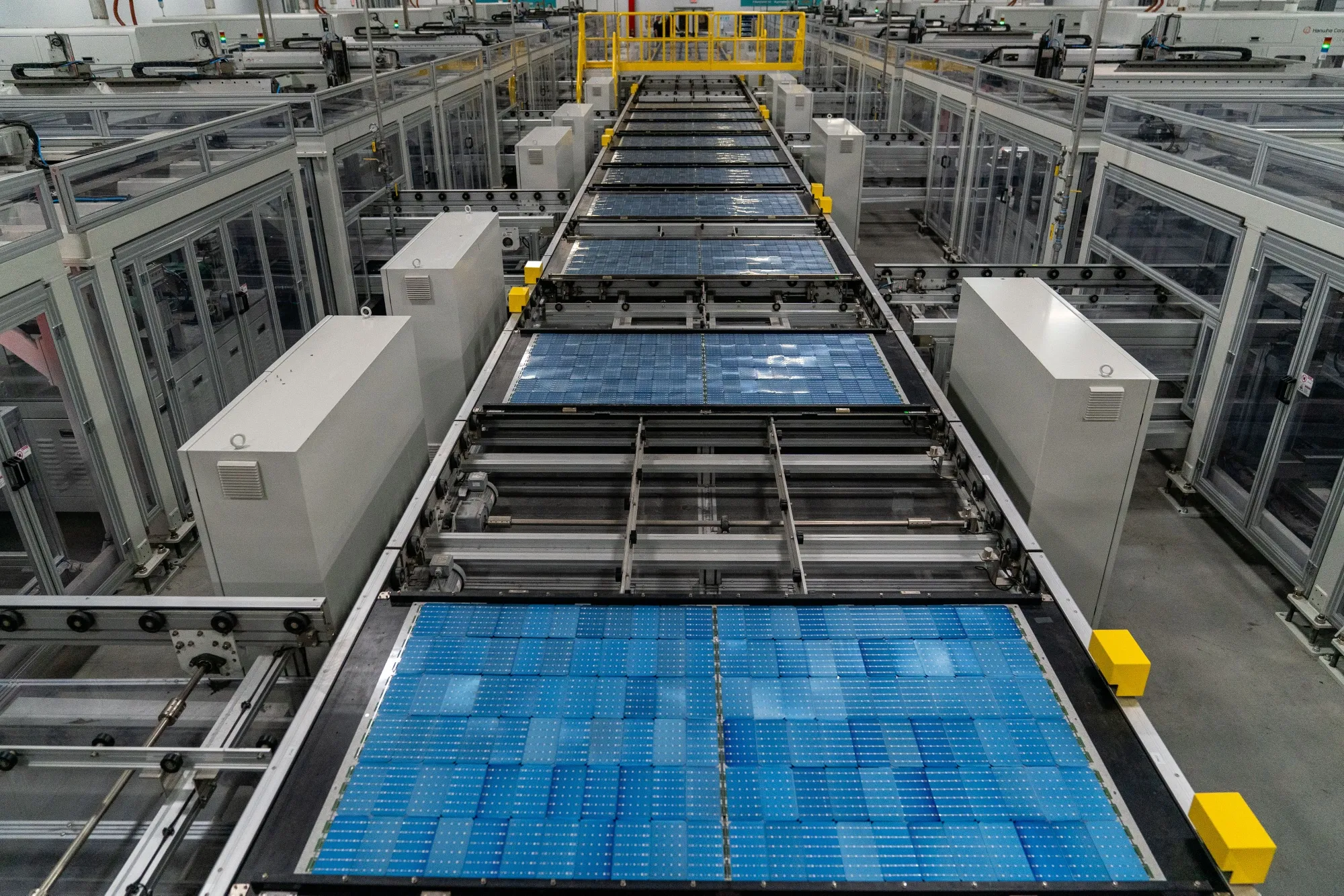 Solar panel cells move along a conveyor at a manufacturing facility in Georgia.