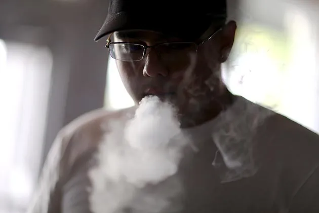 A customer shopping for electronic cigarettes at the Vapor Shark store in Miami