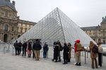 Visitors wait in line for access to the Louvre Museum in Paris, France, on&nbsp;Jan. 12.