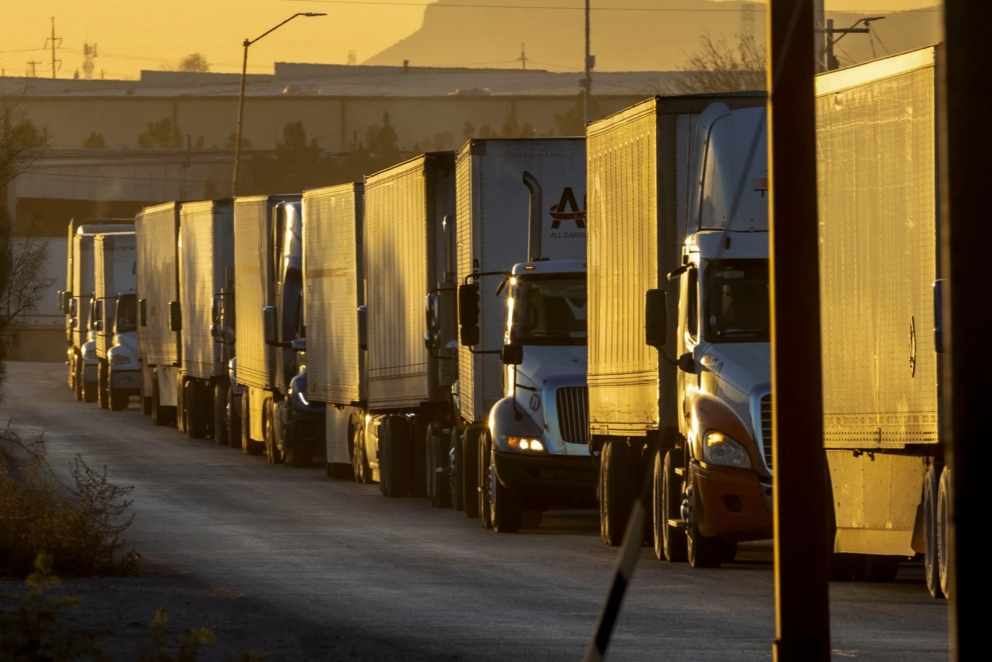 Tractor trailers wait in line on the US-Mexico border in Juarez, Chihuahua state, Mexico.