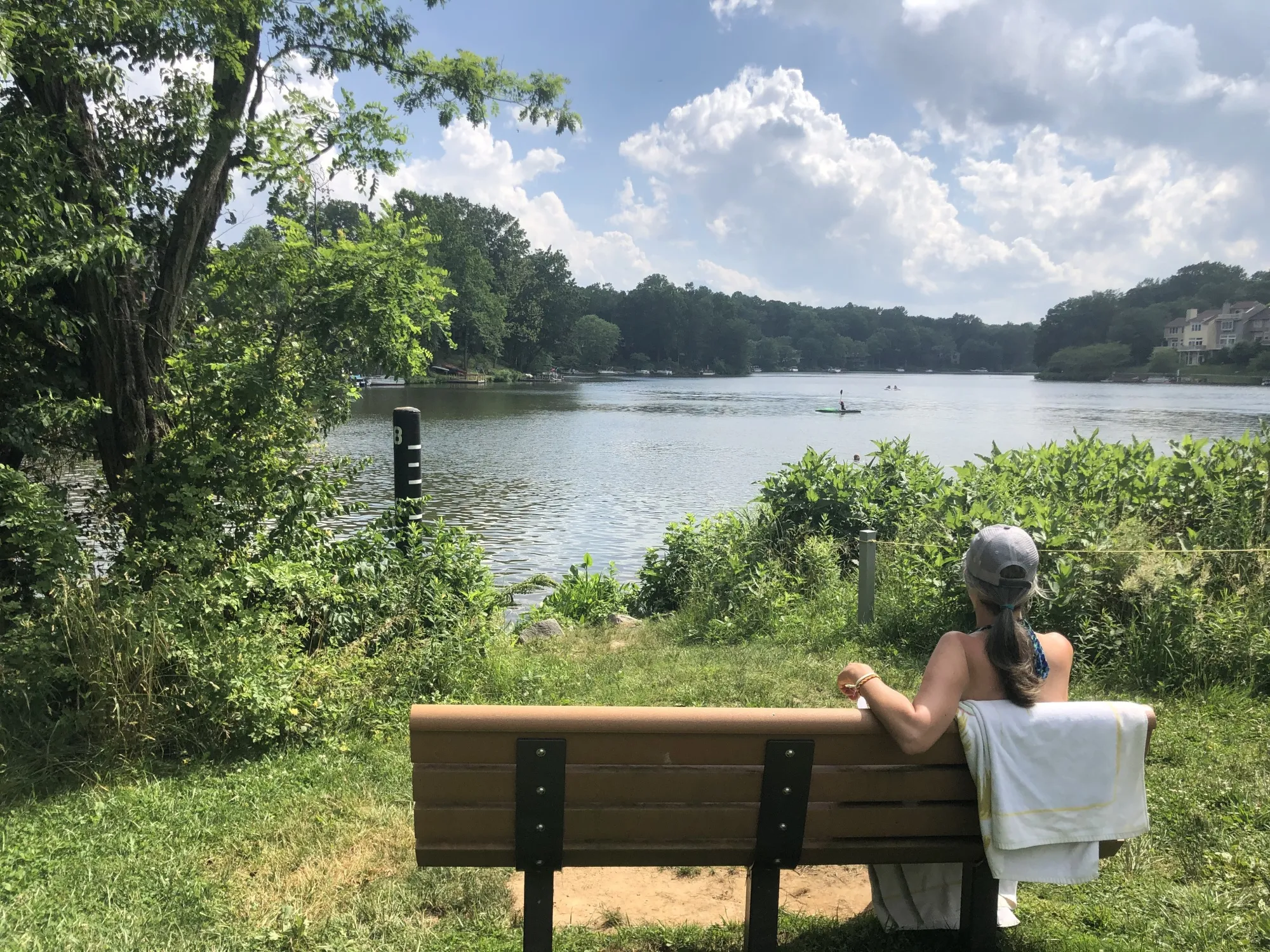 At Lake Audubon in Reston, Virginia, Tricia Fischer watches her kids cool off.