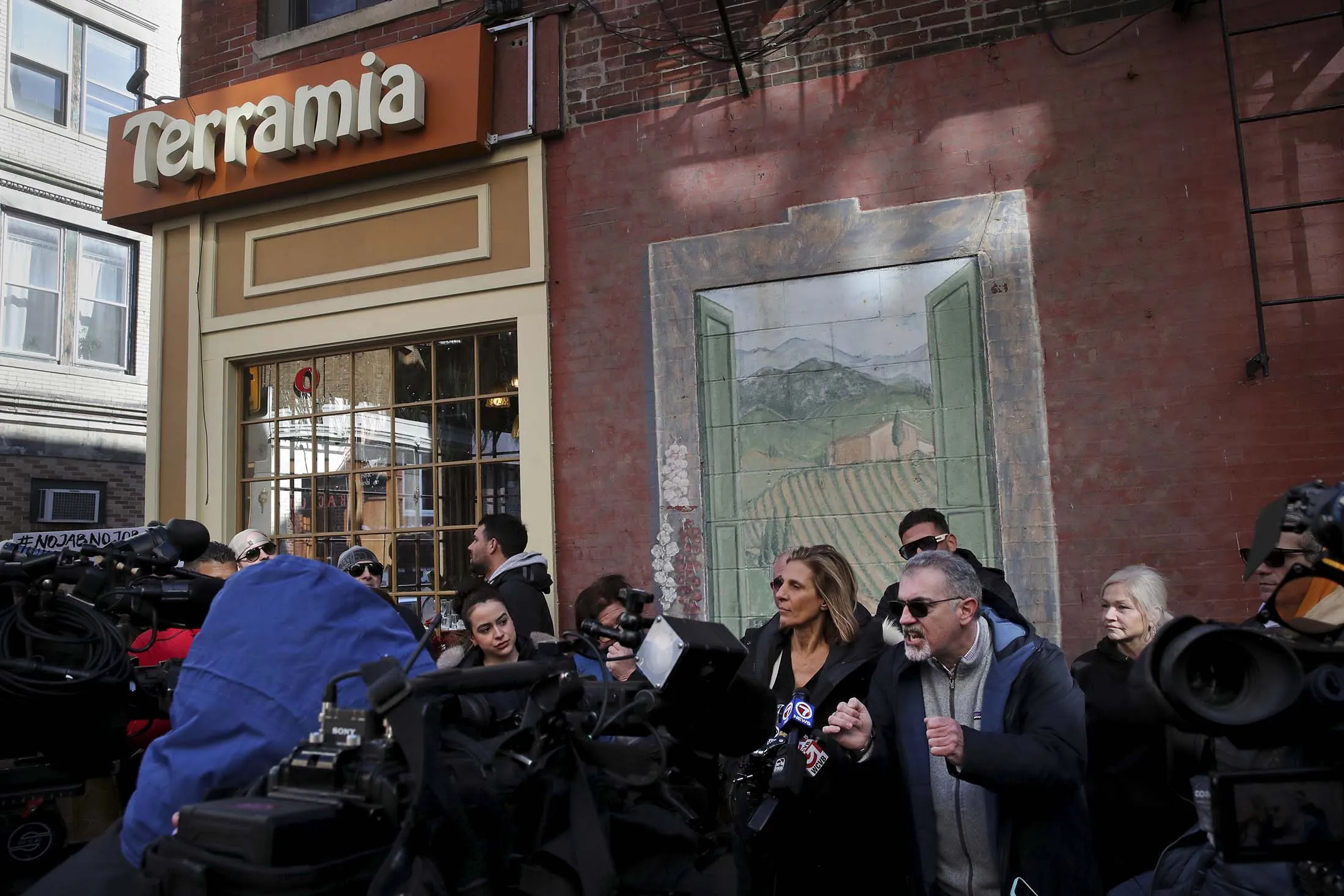 North End restaurant owners speak to the media&nbsp;outside Terramia Ristorante in Boston,&nbsp;on March 29.