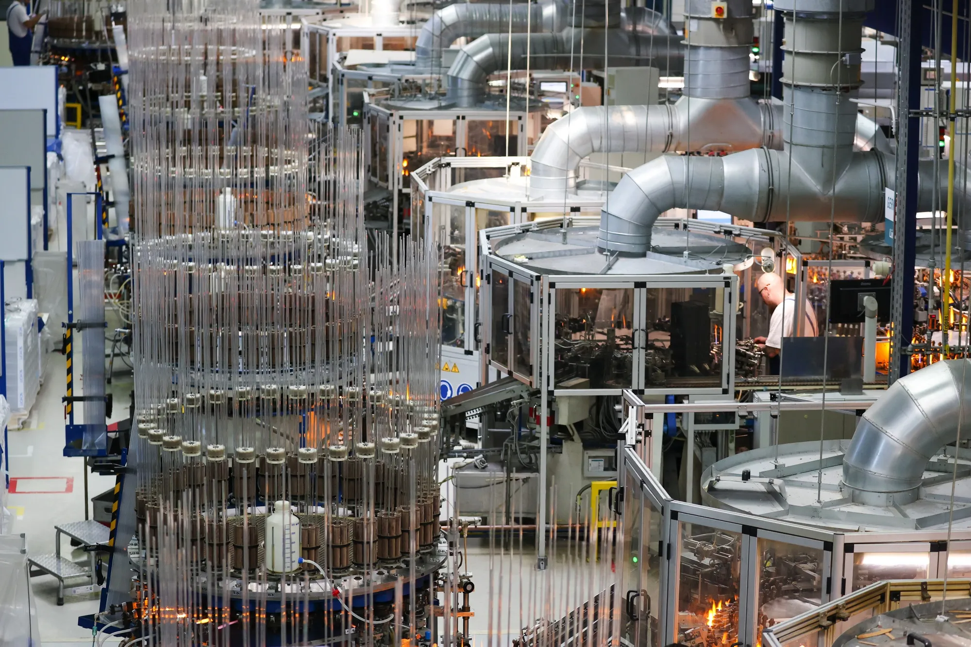 Glass production machinery operates at the Gerresheimer factory in Buende, Germany.