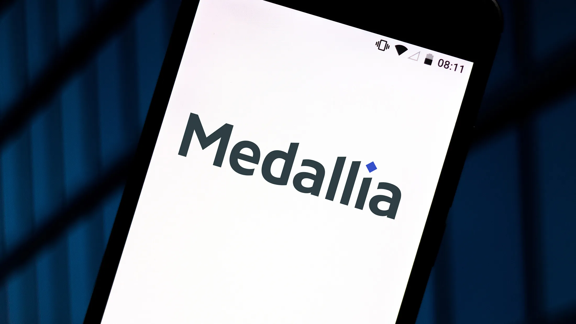 In this photo illustration a Medallia logo seen displayed on